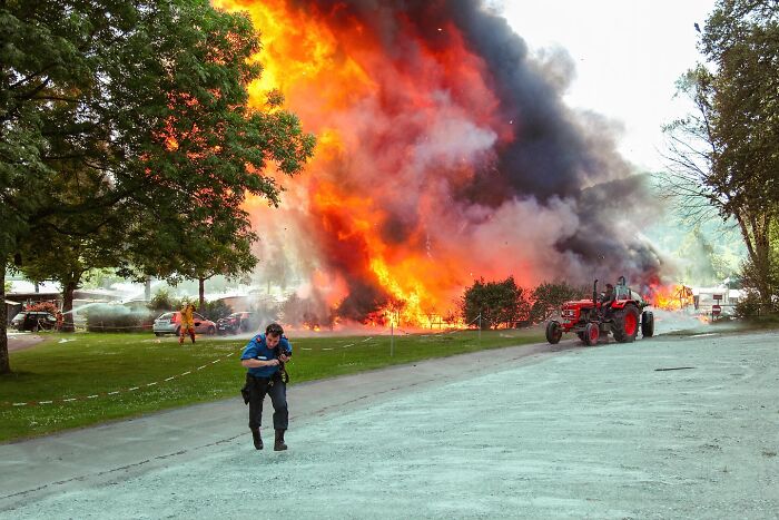 Firefighters respond to a large blazing fire in nature, capturing intense life moments around the world.