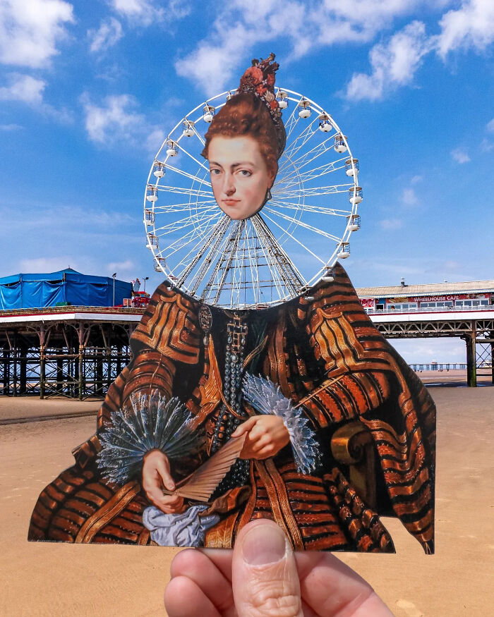 Paper cutout art combines historical portrait with a Ferris wheel in creative artist travels scene on the beach.
