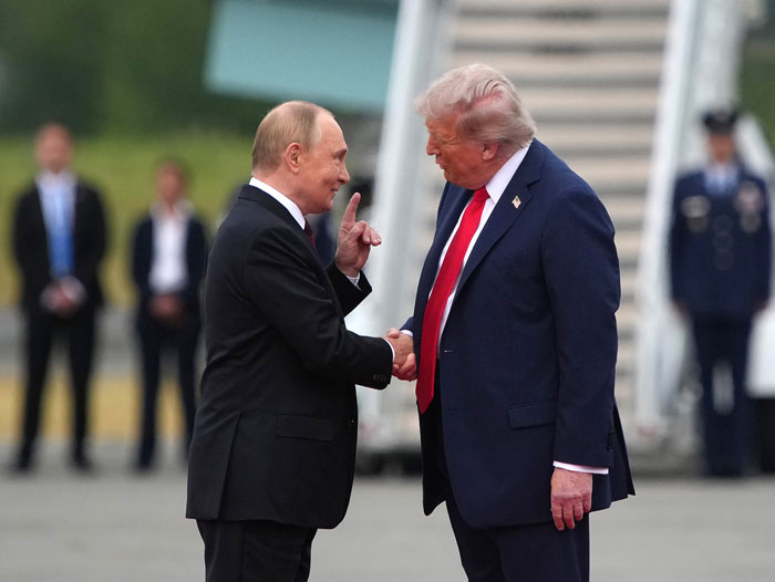 Trump and Putin's Awkward 'Yanking' Handshake Goes Viral Amid Historic Meeting As Body Language Expert Reveals Significance