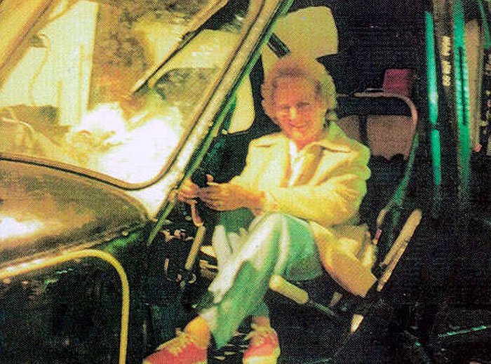 Elderly woman sitting inside a dark vehicle with a creepy and unsettling atmosphere captured in the moment.