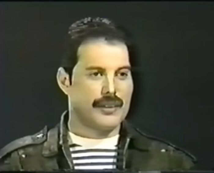 Man with mustache and striped shirt speaking in a vintage video, illustrating videos that gain meaning with more context - 2