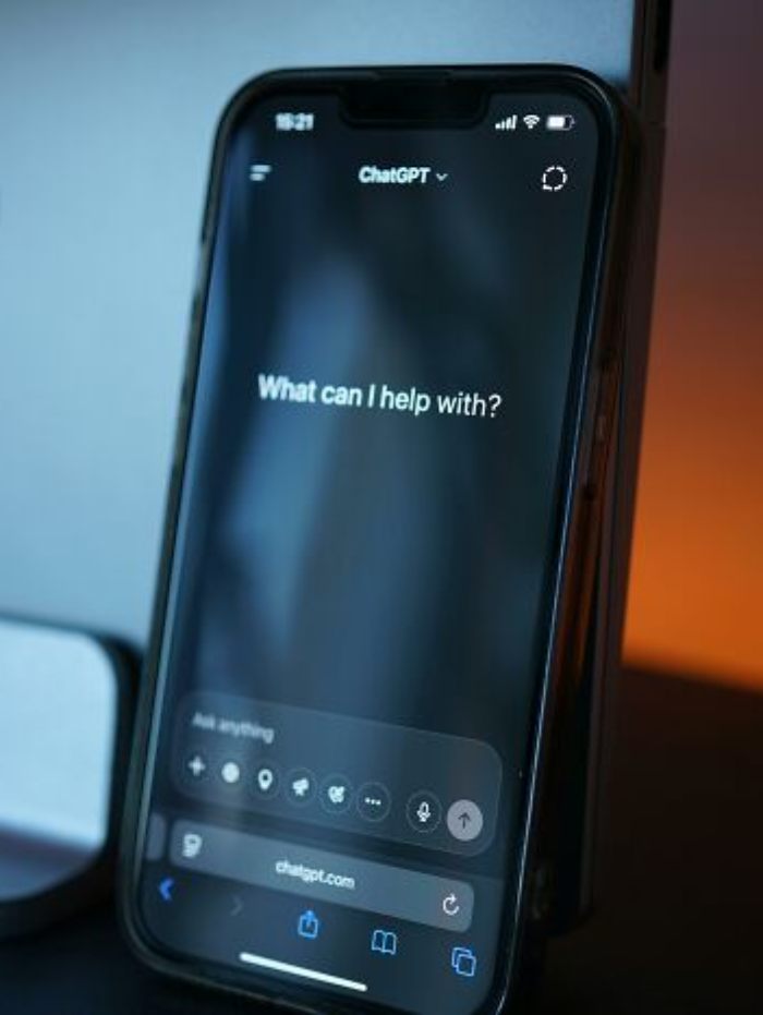 Smartphone screen showing ChatGPT interface asking what it can help with, linked to AI and missed flight claims.