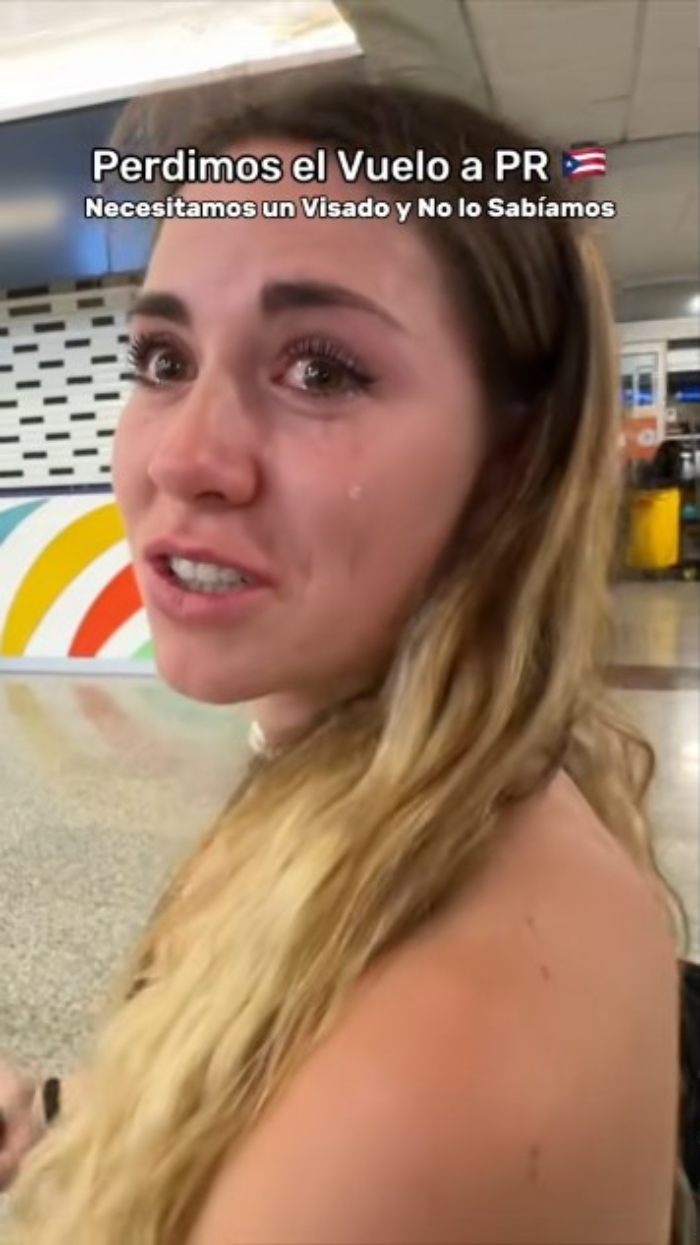 Tearful influencer at airport blaming ChatGPT for missed flight with visible tears and emotional expression