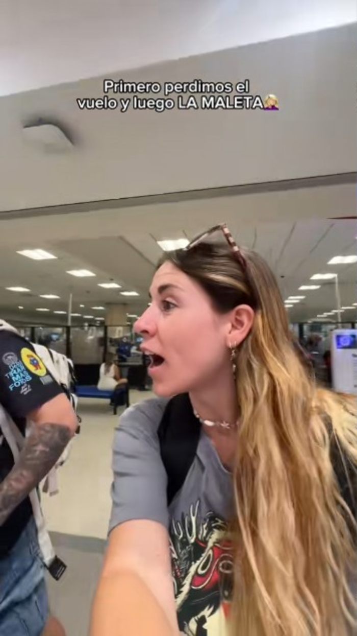 Tearful influencer at airport blaming ChatGPT for missed flight, claiming AI took revenge for insults.