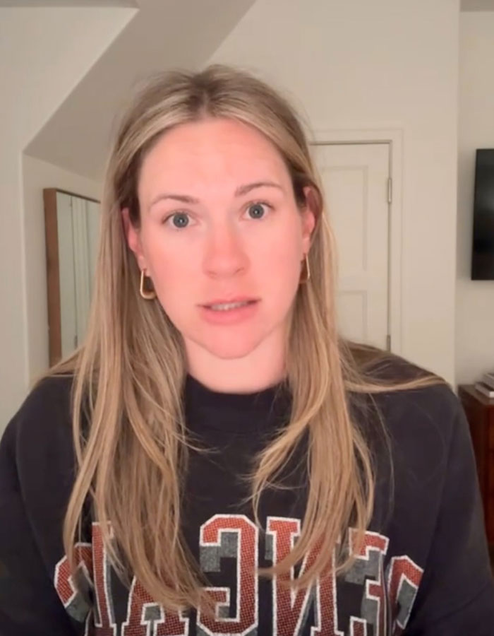 Woman with long blonde hair speaking about extreme diarrhea on plane causing emergency landing and flight cancellation.