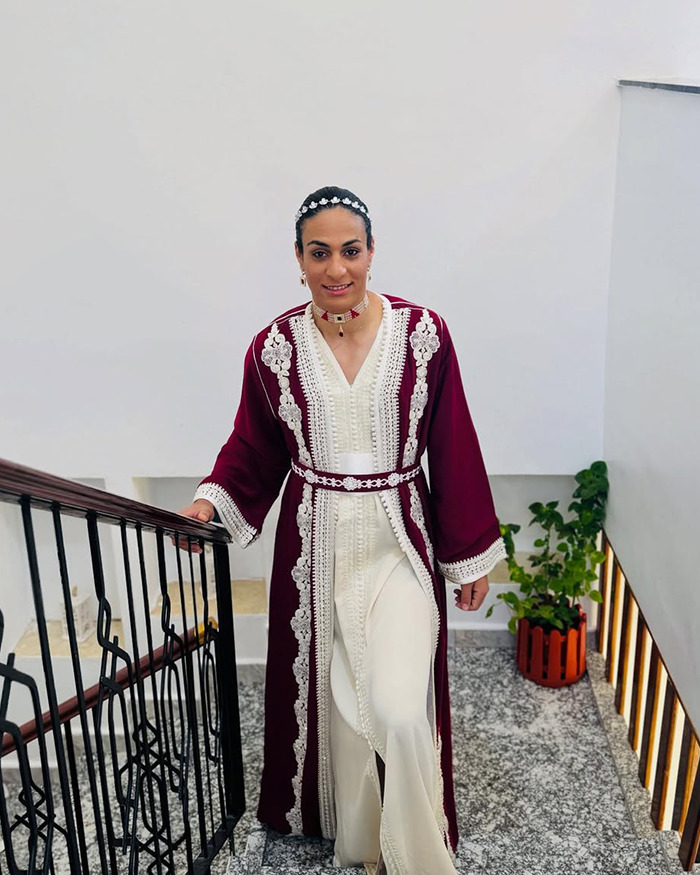 Imane Khelif in a traditional outfit showcasing a dramatic makeover after Paris Olympics gender controversy.
