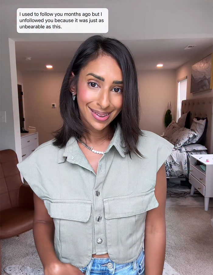 Woman smiling in a casual outfit, discussing feelings of jealousy related to Sweeney&rsquo;s AE ad and its impact on her.