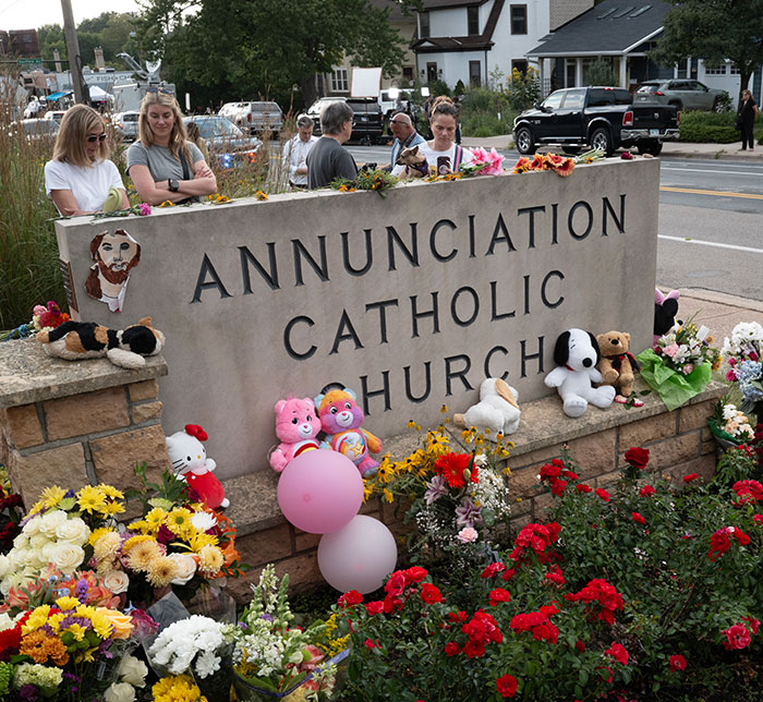 Community gathers at Annunciation Catholic Church memorial after Minneapolis school attacker, mother not cooperating with police.