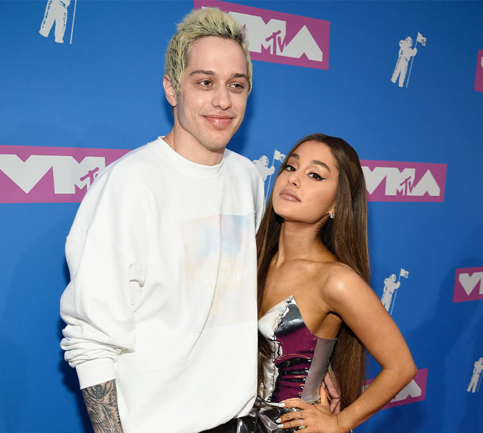 Pete Davidson and Ariana Grande posing on the red carpet at the MTV Video Music Awards event.