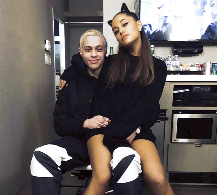 Pete Davidson and Ariana Grande sitting closely, with Pete addressing scrutiny about the size of his manhood.