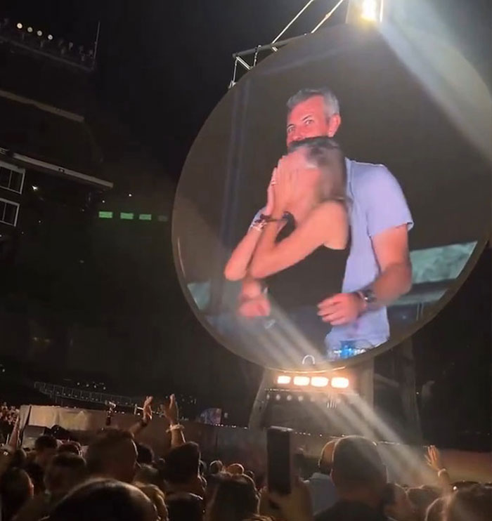 Large crowd watching a stadium kiss cam showing an adult star Sophie Rain with Coldplay Kiss Cam CEO Andy Byron. Large crowd watching a stadium kiss cam showing an adult star Sophie Rain with Coldplay Kiss Cam CEO Andy Byron.