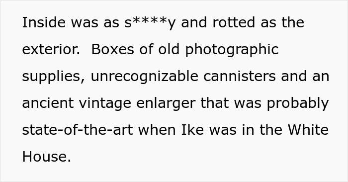 Old photographic supplies and vintage enlarger found inside a portable darkroom from a surplus auction.