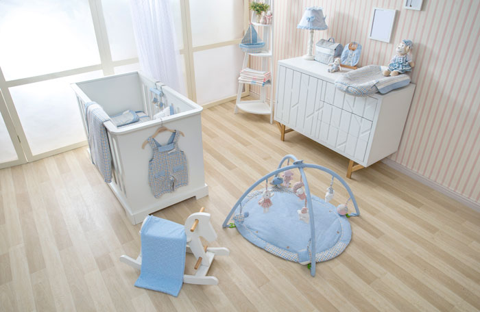 Nursery room with baby crib, play gym, and toys symbolizing hope for disabled daughter to get pregnant and become grandma.