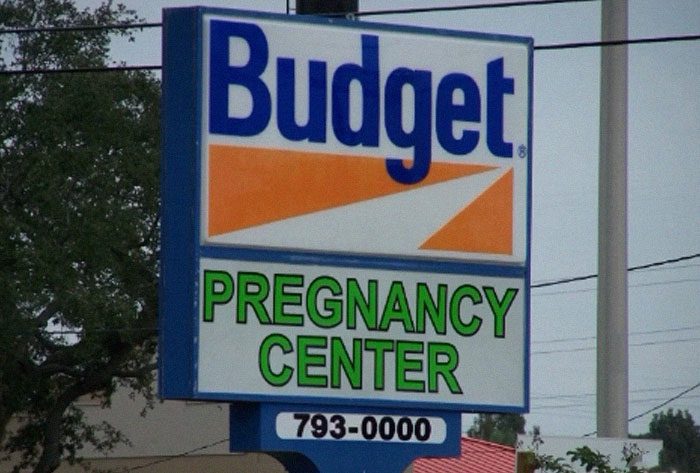 Budget sign for a pregnancy center showing a design fail with confusing brand association and messaging.