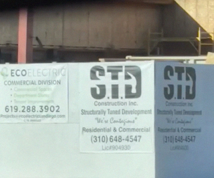 Construction site signage with design fails, including unclear logos and hard-to-read contact information.