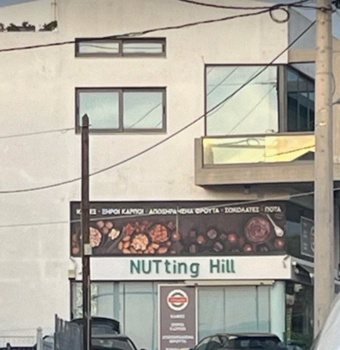 Sign for a store with a design fail showing the name Nutting Hill with inconsistent letter casing on a building facade.