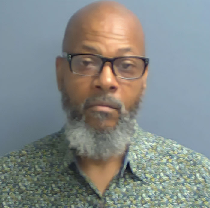 Man with glasses and gray beard wearing a patterned shirt, related to road rage incident and pregnant teen shooting case. Man with glasses and gray beard wearing a patterned shirt, related to road rage incident and pregnant teen shooting case.