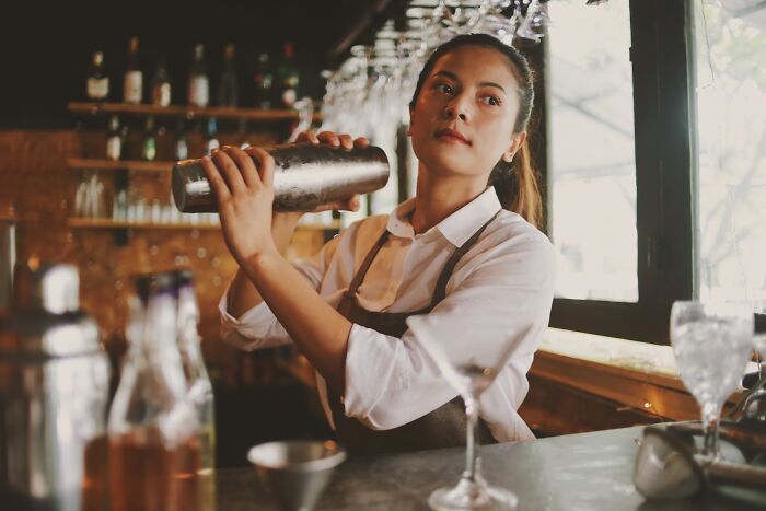 Bartender shaking cocktail at a bar, illustrating moments when Reddit wasn't for the faint of heart.