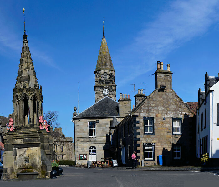 Historic European buildings under a clear blue sky showcasing the biggest world unexpected discoveries in architecture and heritage.
