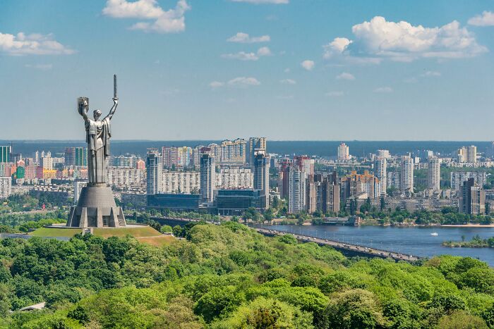 Statue overlooking a city skyline and river, representing one of the biggest world unexpected discoveries in history.