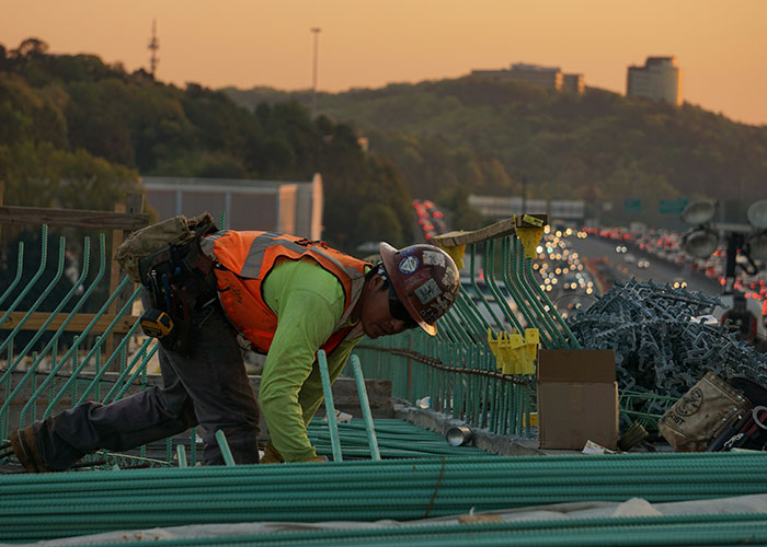 Construction worker in safety gear working on a job site, highlighting scary moments experienced by blue collar workers.