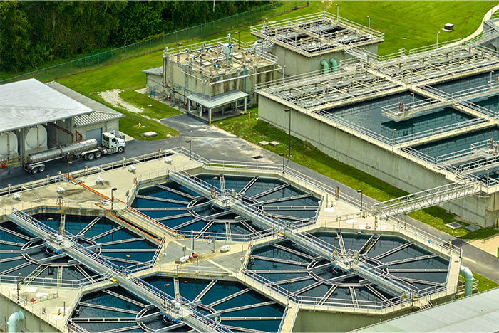 Aerial view of a profitable water treatment facility showcasing key industries with high revenue potential today.
