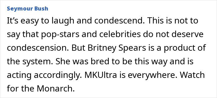 Britney Spears in a gold minidress during a raunchy dance moment, experiencing a nip slip on stage.