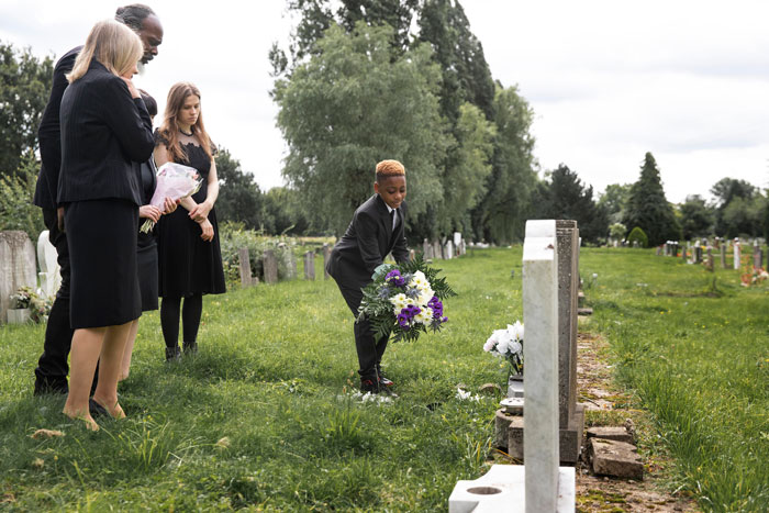Stepkids feeling hurt and abandoned as widow chooses to bury late husband with his first wife and child at cemetery.