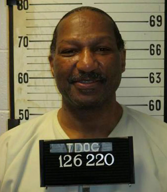 Mugshot of inmate against height chart, related to painful execution after state refuses to turn off defibrillator. - 1
