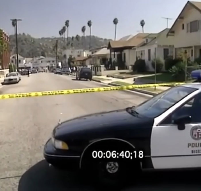 Police car blocking residential street with yellow tape during investigation related to inmate cries out during painful execution defibrillator. - 3