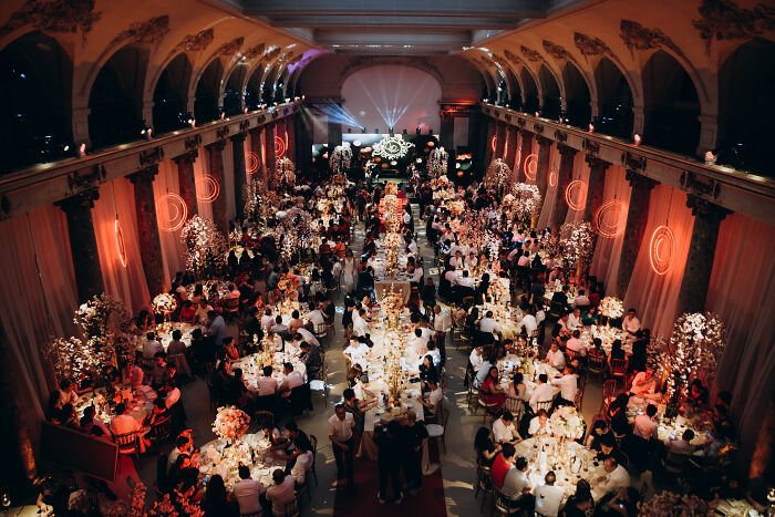 Large elegant banquet hall filled with guests at a lavish event highlighting the wealth gap perspective.