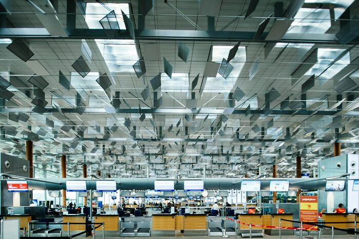 Modern airport interior with unique ceiling design, illustrating totally safe things that people can’t stop freaking out about.