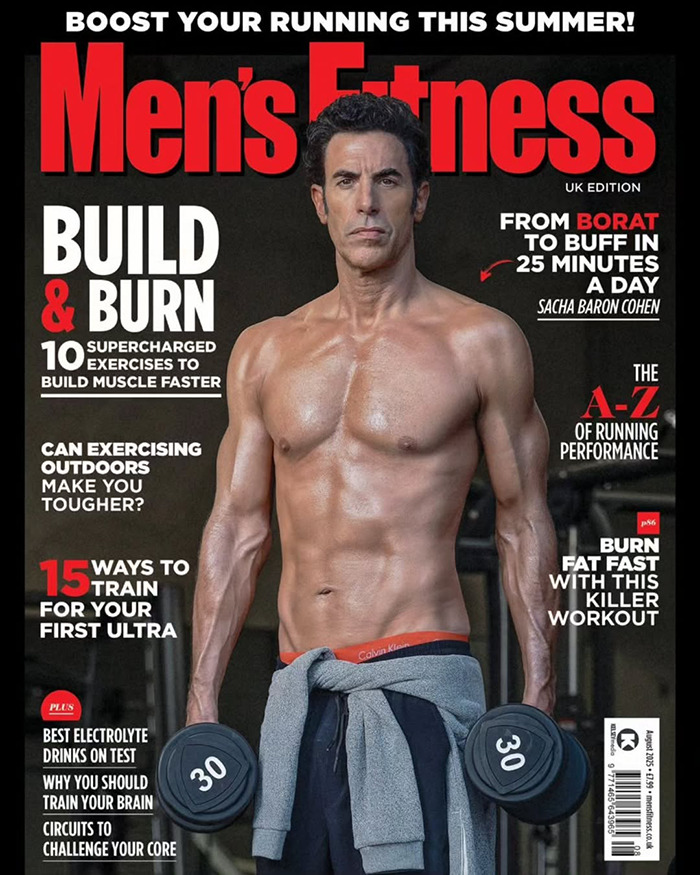 Shirtless Sacha Baron Cohen holding weights on Men's Fitness cover showing Marvel body transformation and muscle building tips. - 2