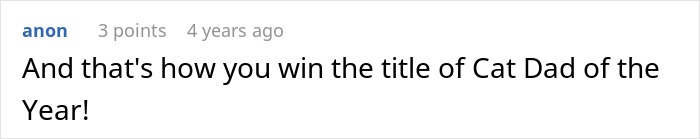 Man feeding a small kitten inside a subway station, showing kindness and care in an urban setting.
