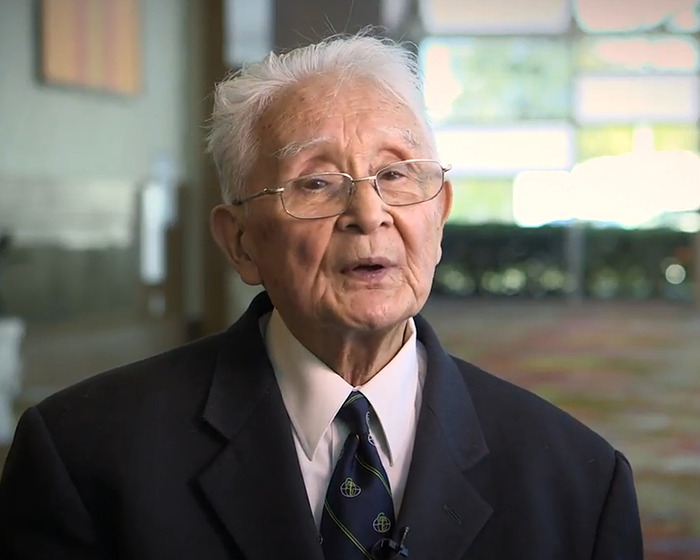 Elderly man in glasses and suit discussing Marilyn Monroe autopsy with suspicious findings decades later indoors. - 3