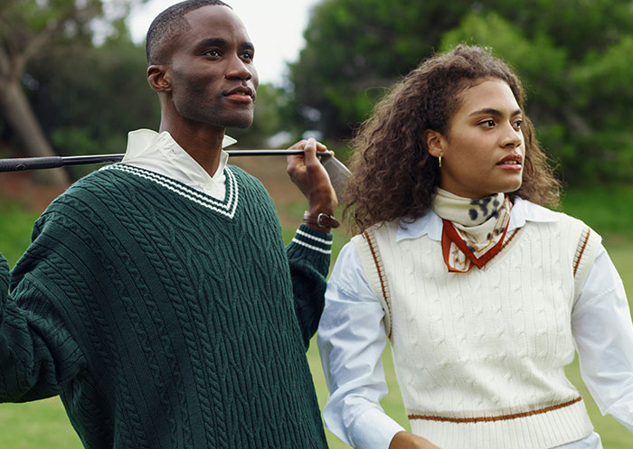 Couple enjoying golf outdoors, illustrating the ups and downs of having a partner who went from rags to riches.