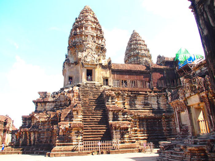 Ancient temple ruins with worn stone steps and towers, one of the creepy vibes places people visited around the world.