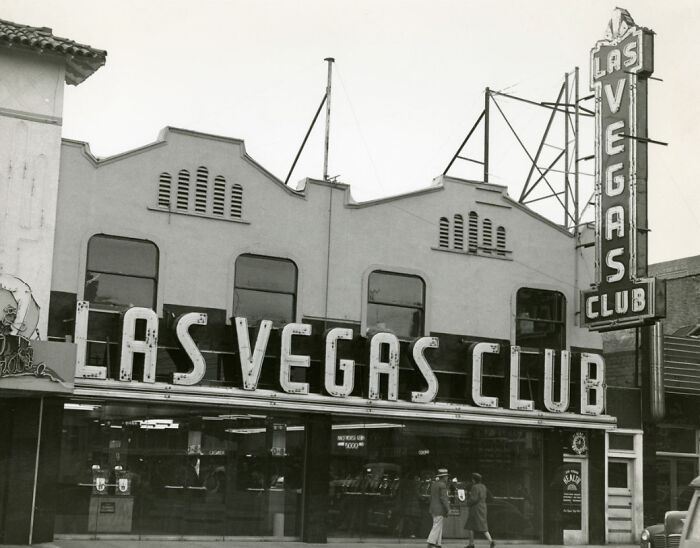 Historic black and white photo of Las Vegas Club storefront showcasing early Vegas architecture and signage.