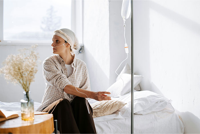 Young woman receiving IV therapy in a hospital room, reflecting on bizarre reasons why someone wanted a divorce.