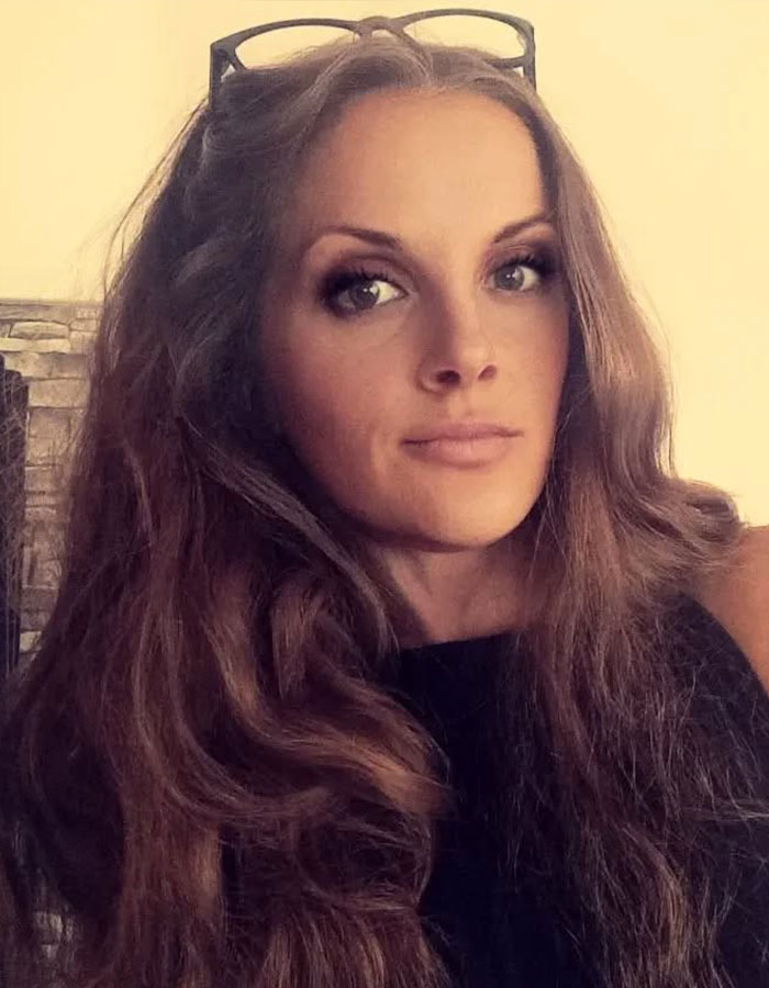 Young woman with long hair and glasses on head, illustrating rare disorder diagnosis after years of dismissed pain by doctors. Young woman with long hair and glasses on head, illustrating rare disorder diagnosis after years of dismissed pain by doctors.