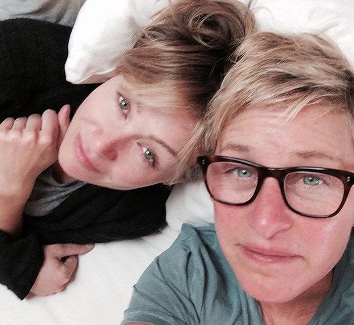 Ellen DeGeneres and another person lying down, close-up selfie highlighting the bullying controversy involving former staff claims. Ellen DeGeneres and another person lying down, close-up selfie highlighting the bullying controversy involving former staff claims.