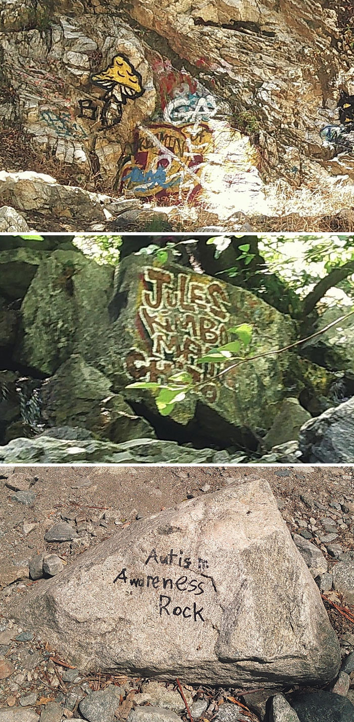 Graffiti and writing on natural rocks showing people with no care about rules and etiquette in outdoor settings.