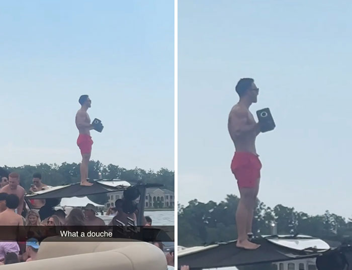 Man in red shorts standing on boat canopy at crowded lake party ignoring rules and etiquette around him.