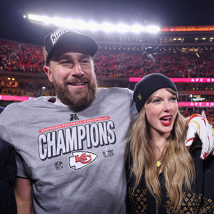 Travis Kelce and Taylor Swift celebrating on the field with fans spotting a hidden engraving on her $1M engagement ring. Travis Kelce and Taylor Swift celebrating on the field with fans spotting a hidden engraving on her $1M engagement ring.