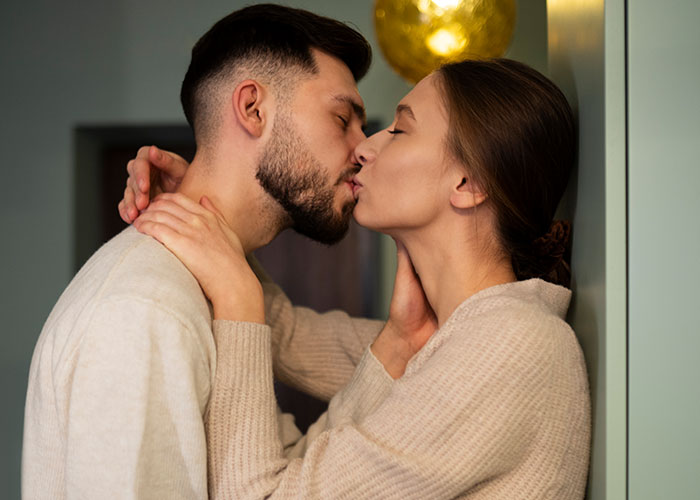 Couple sharing an intimate kiss indoors, hinting at the bride&rsquo;s world crumbling after her twin sister&rsquo;s and fianc&eacute;&rsquo;s secret.