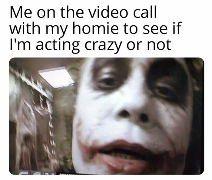 Close-up of a person in black makeup mimicking a creepy but funny meme about video calls and acting crazy.