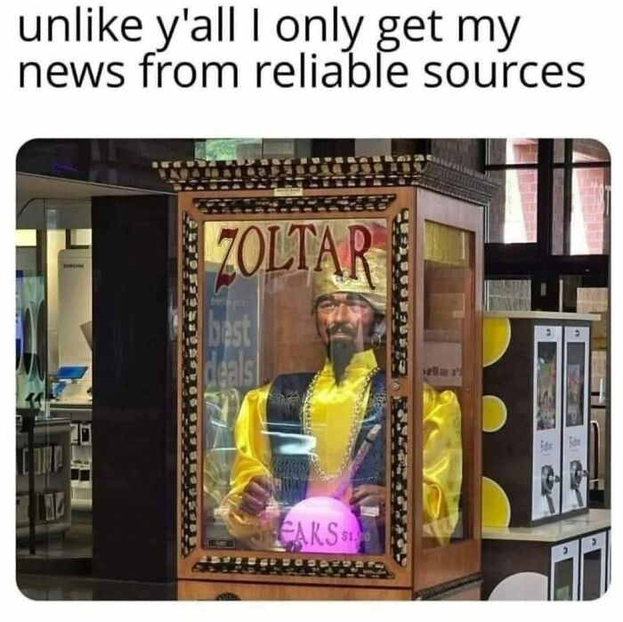 Fortune teller machine named Zoltar with humorous text about getting news from reliable sources, creepy but funny meme.