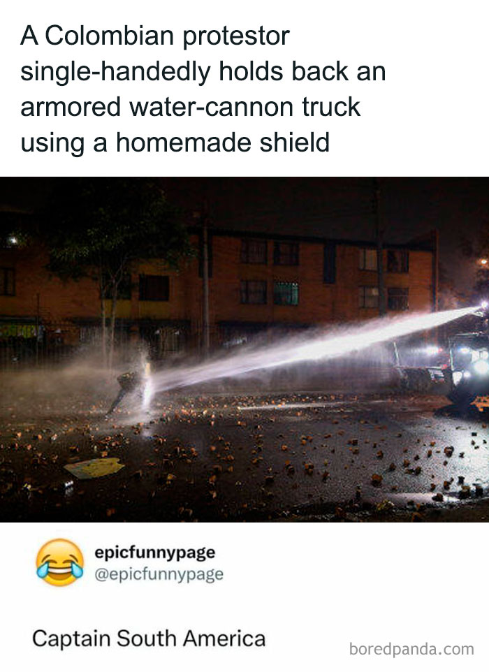 Colombian protestor using a homemade shield to hold back a water-cannon truck in a night street scene meme.