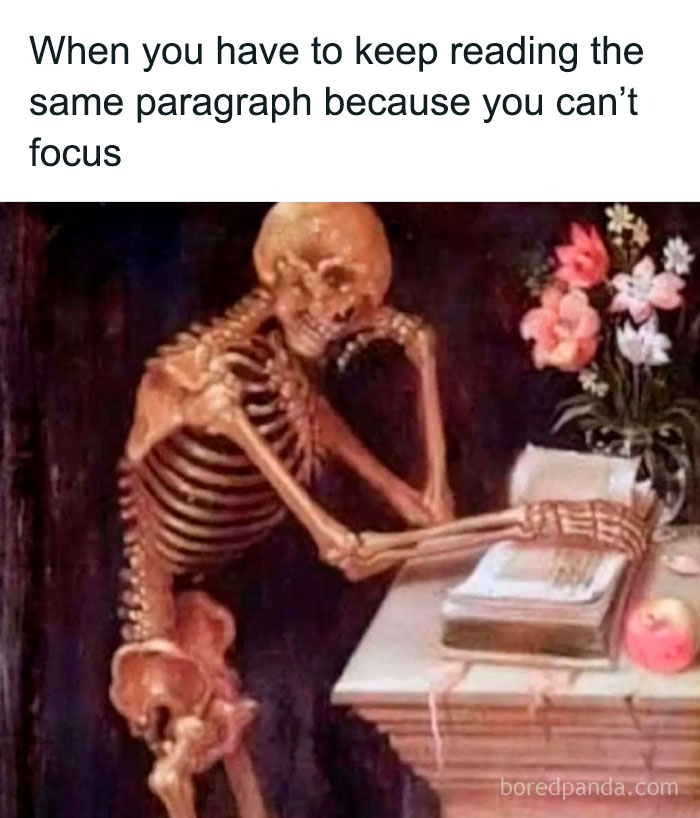 Skeleton sitting at desk reading a book, illustrating boredom and lack of focus in entertaining posts and memes.