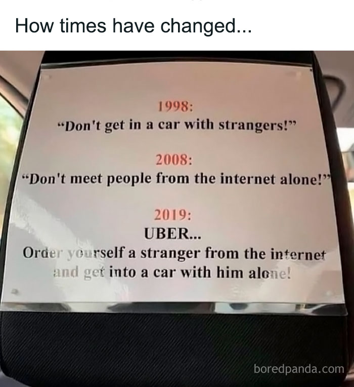 Sign in a car humorously showing how warnings about strangers changed from 1998 to 2019 Uber rides with strangers from the internet.